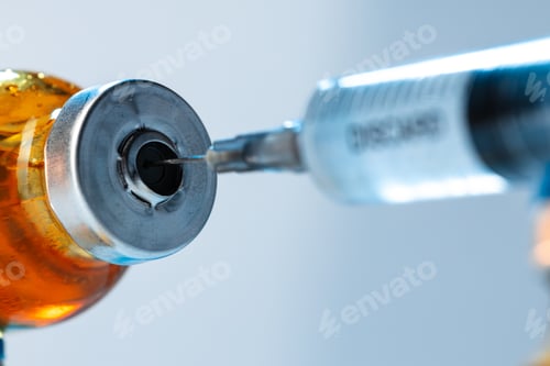 Preview: Vaccine bottle with a syringe taking the vaccine from it