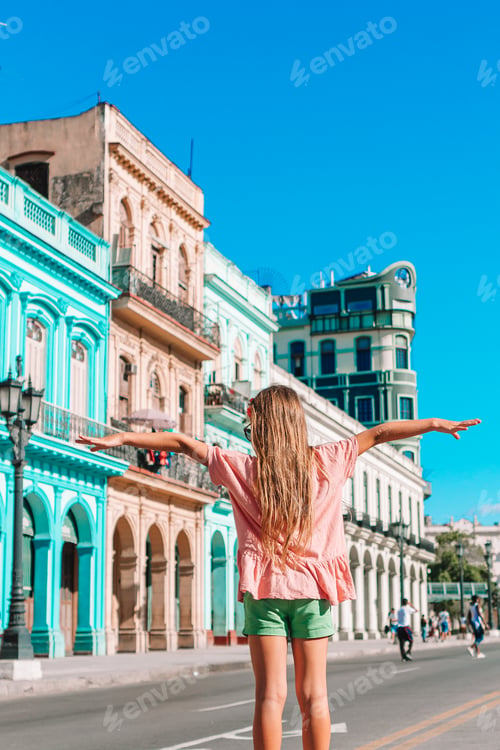 Preview: Tourist girls in popular area in Havana, Cuba. Young woman traveler smiling