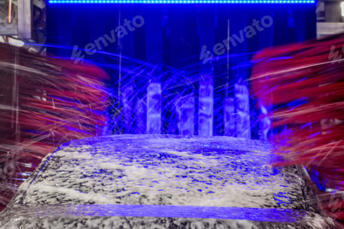Preview: Brushes spinning and foam spraying at automated car wash