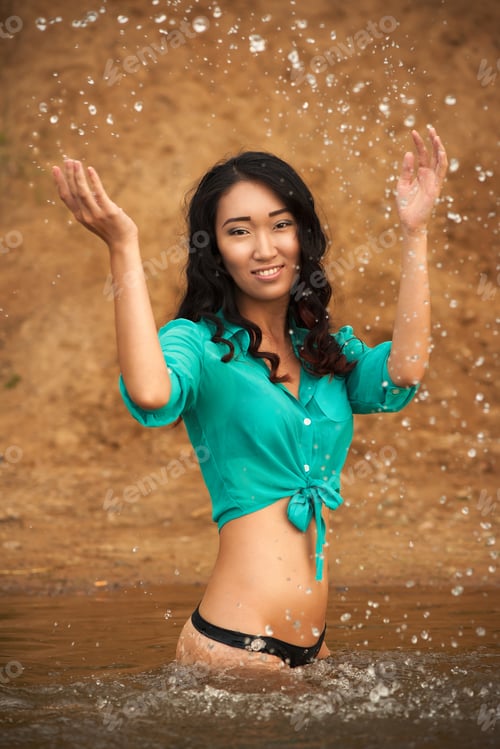 Preview: Sexy Young Asian Woman Wearing Bikini Bottom And Shirt