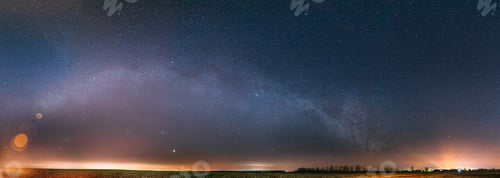 Preview: Night Starry Sky With Glowing Stars Above Countryside Landscape. Milky Way Galaxy And Rural Field