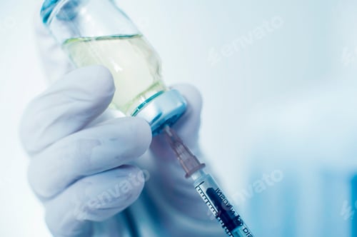Preview: doctor draws medicine into a syringe close-up