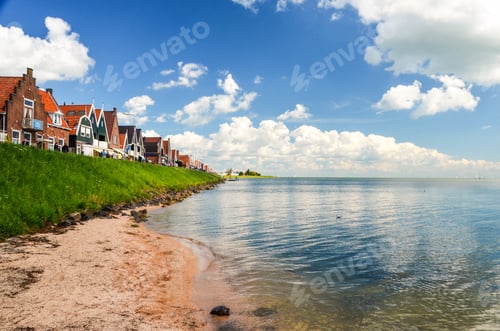 Preview: Closeup shot of town houses on a river bank on a sunny day