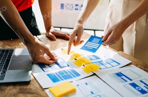Preview: UX developer and ui designer brainstorming about mobile app interface wireframe design with