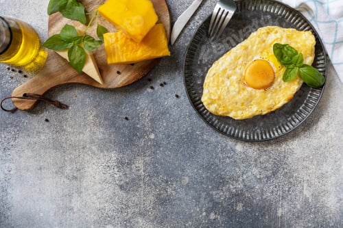 Preview: Baked cottage cheese pumpkin bread with cheese and egg filling on stone background.