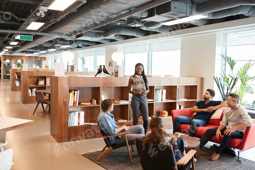 Preview: Casually Dressed Businessmen And Businesswomen Having Informal Meeting In Modern Office
