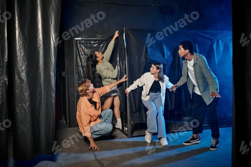 Preview: group of multiethnic young people engaged in thrilling escape room challenge, indoor adventure