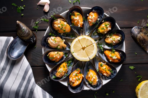 Preview: Steamed mussels with parsley and garlic on plate