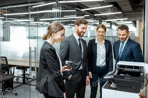 Preview: Business people near the copier in the hallway