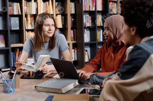 Preview: College Students Studying In Library
