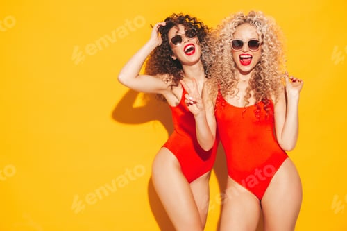 Preview: Two hot beautiful women posing in studio