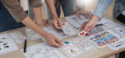 Preview: A smart and handsome young Asian male website developer is talking and planning a new project with a