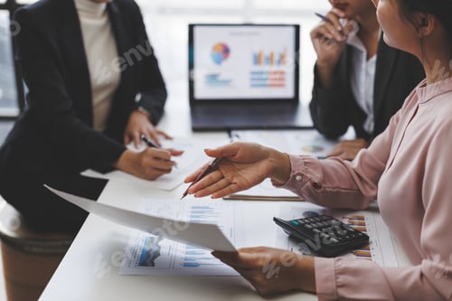 Preview: Businesswomen working together analyzing financial charts and documents