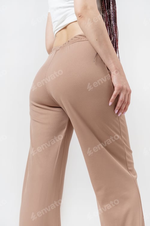 Preview: Fashionable young beautiful woman with dreadlocks posing on white background
