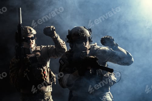 Preview: Military soldiers in action during training exercise in smoke-filled environment at night