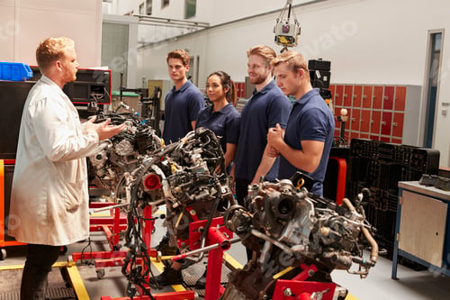 Preview: Apprentices studying car engines with a mechanic