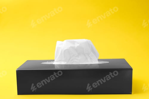 Preview: Box with paper handkerchiefs on yellow background. Space for text