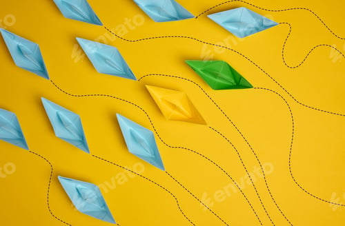 Preview: Paper boats on a yellow background with paths of movement, representing the concept of individuality