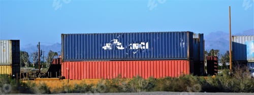 Preview: Railroad Transportation and Logistics! A freight train hauling stacked shipping containers.