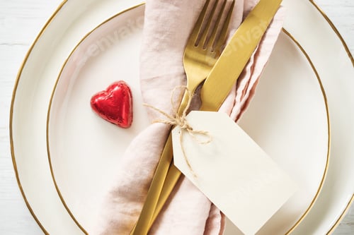 Preview: Closeup View on Golden Rim Plates with Golden Cutlery and Tag.