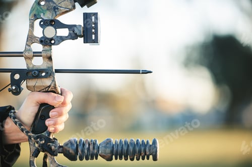 Preview: Archery bow and closeup of person at shooting range for competition, game or learning in field or o