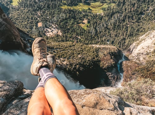 Preview: Personal perspective woman sitting on top of the waterfall