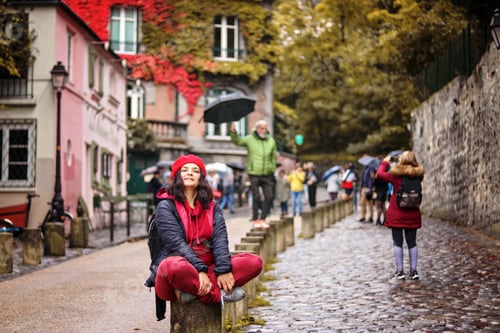Preview: People in the autumn rainy city.