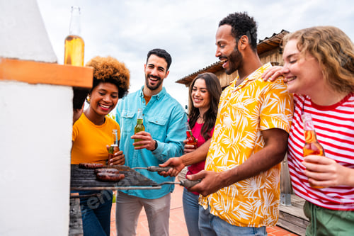 Preview: Multiethnic group of friends having dinner barbecue party on rooftop at home