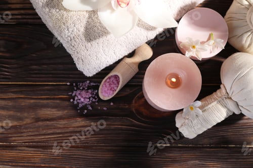 Preview: Composition with spa supplies and flowers on wooden table, flat lay. Space for text