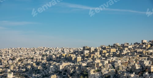 Preview: Wide angle shot of several buildings of a city under a clear blue sky