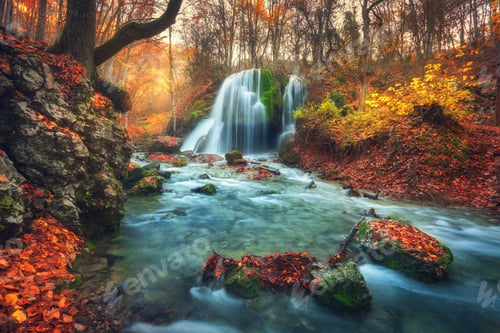 Preview: Autumn forest with waterfall at mountain river at sunset