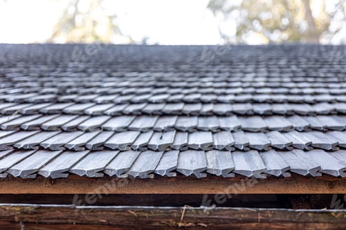 Preview: Close-up, the roof of a house made of wooden tiles.