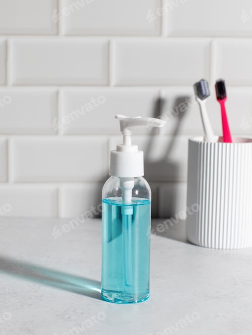 Preview: Liquid soap dispenser mockup with toothbrushes in minimal bathroom interior
