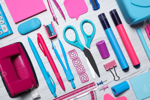 Preview: Different stationery on white wooden background, flat lay