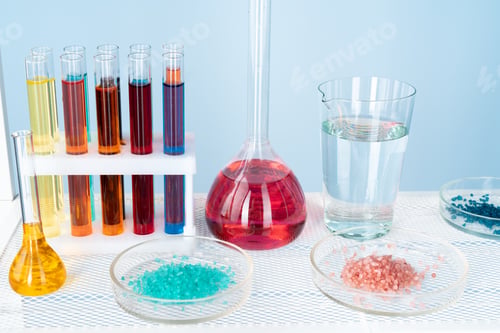 Preview: Chemical laboratory glassware with various colored liquids on table