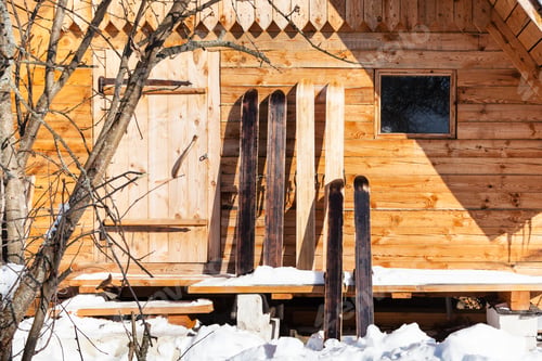 Preview: wide hunter skis in front of wooden cottage