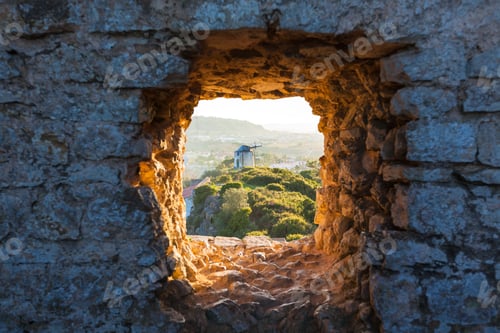 Preview: Old Windmill through Window in Fortress Wall