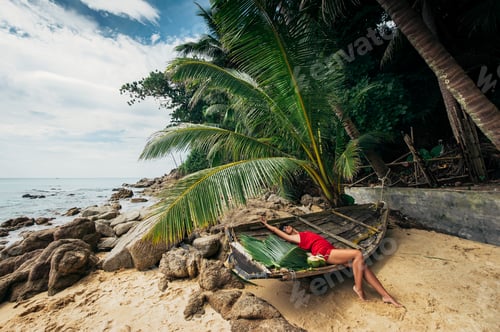 Preview: Beautiful girl on a Paradise beach. Girl sunbathing on the beach. Beautiful woman on the beach