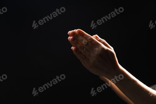 Preview: Religion. Christian woman praying on black background, closeup. Space for text