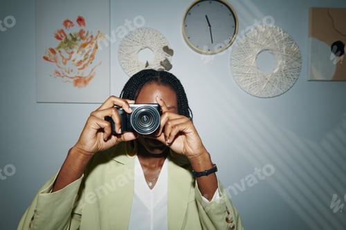 Preview: Woman Taking Photos in Office