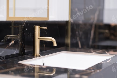 Preview: Bronze water faucet and white pedestal sink in bathroom. Stylish bathroom