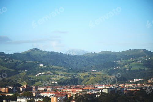 Preview: Mountains over a coastal town