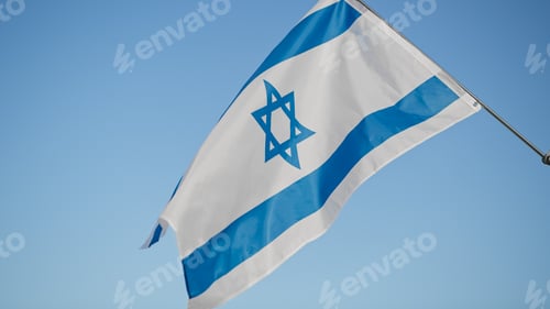 Preview: Flag of Israel on blue sky