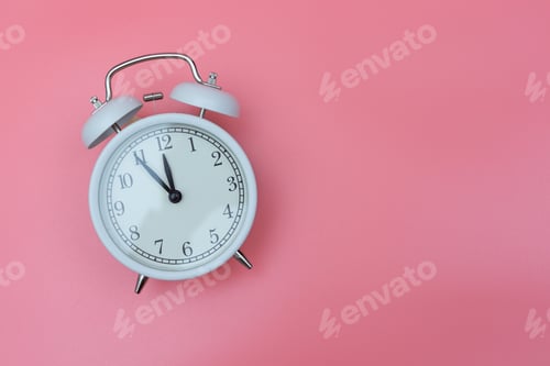 Preview: A white retro clock on a pink background shows 23.55