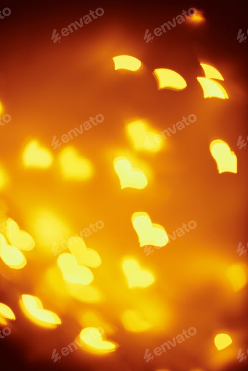 Preview: Abstract background with a golden blurred lights in heart shape. Valentine day concept