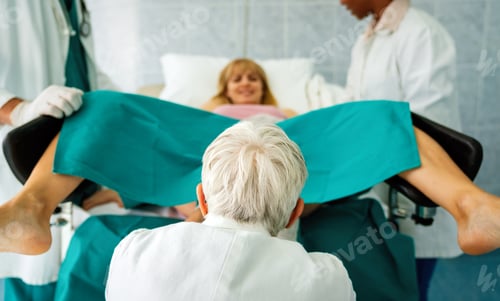 Preview: Pregnant woman pushes to give birth in hospital, obstetrician doctor assisting