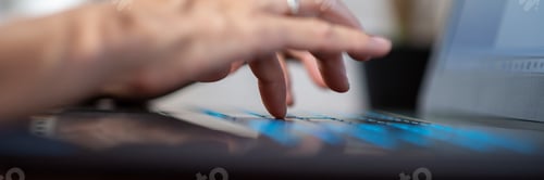 Preview: Female fingers typing glowing laptop computer