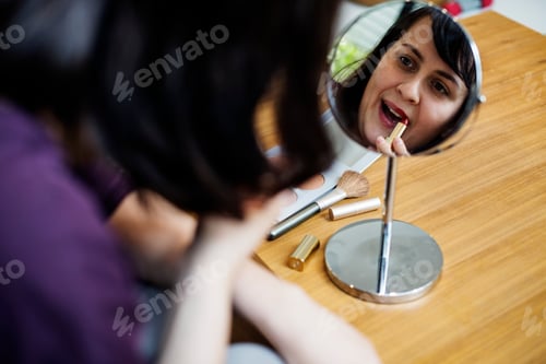 Preview: Woman putting on some makeup