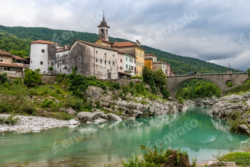 Preview: Scenic Summer View of Kanal na Soci Townscape by the River Soca