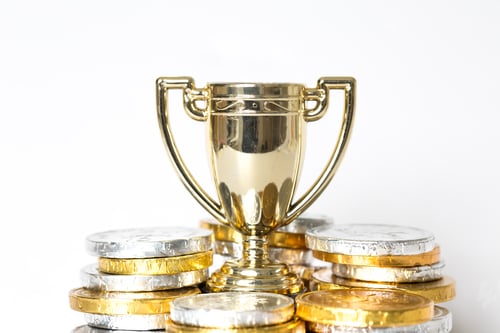 Preview: A gold trophy surrounded by prize-money for the winner of Victor of a competition